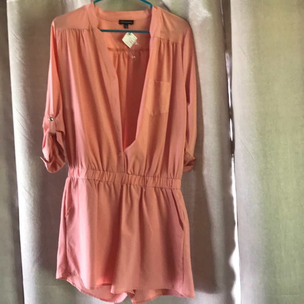 Boutique romper with tags still on.